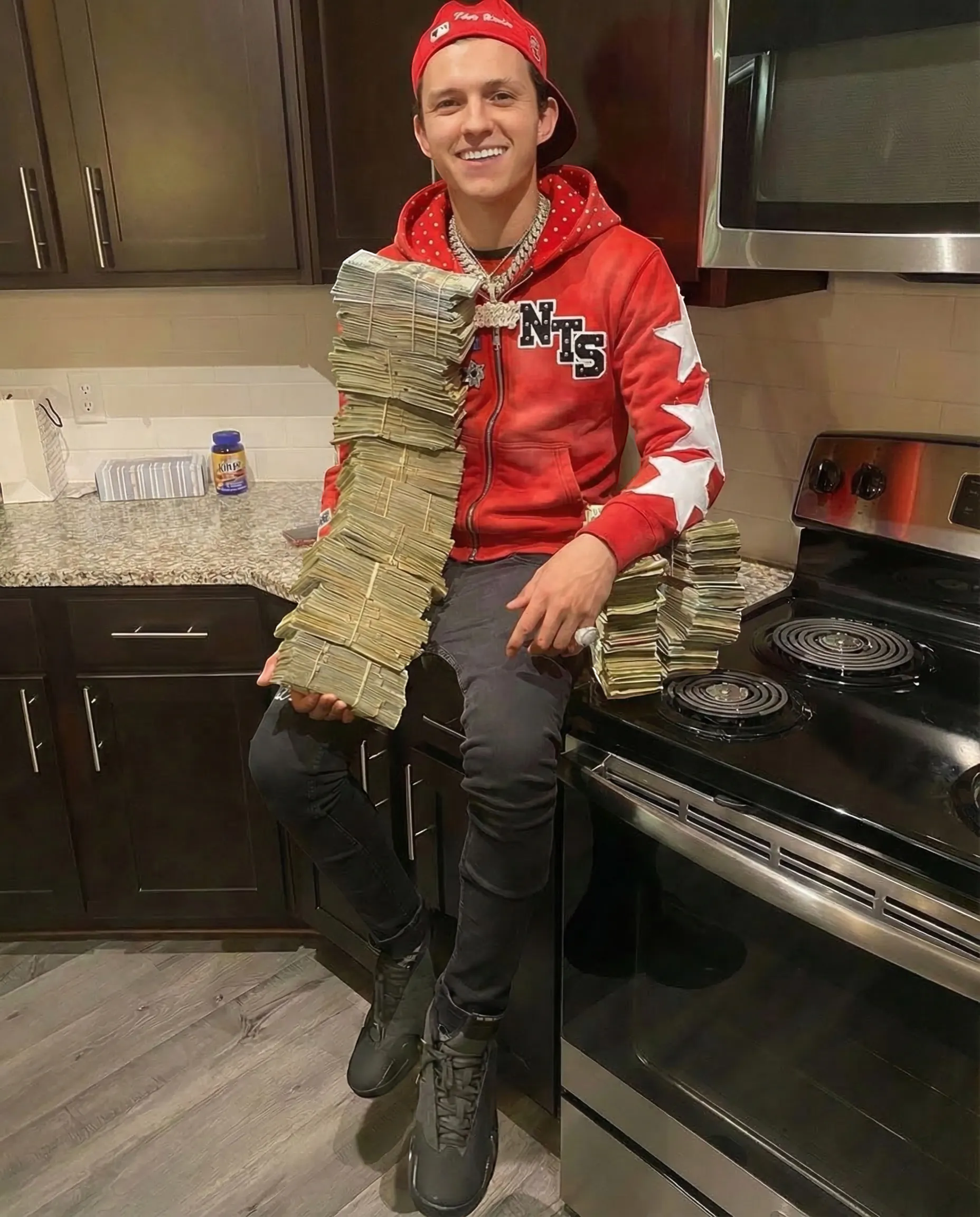 NTS GUARMETSH red zip-up hoodie with white star accents and polka dot lining, paired with black jeans and sneakers. Man holds stacks of cash.